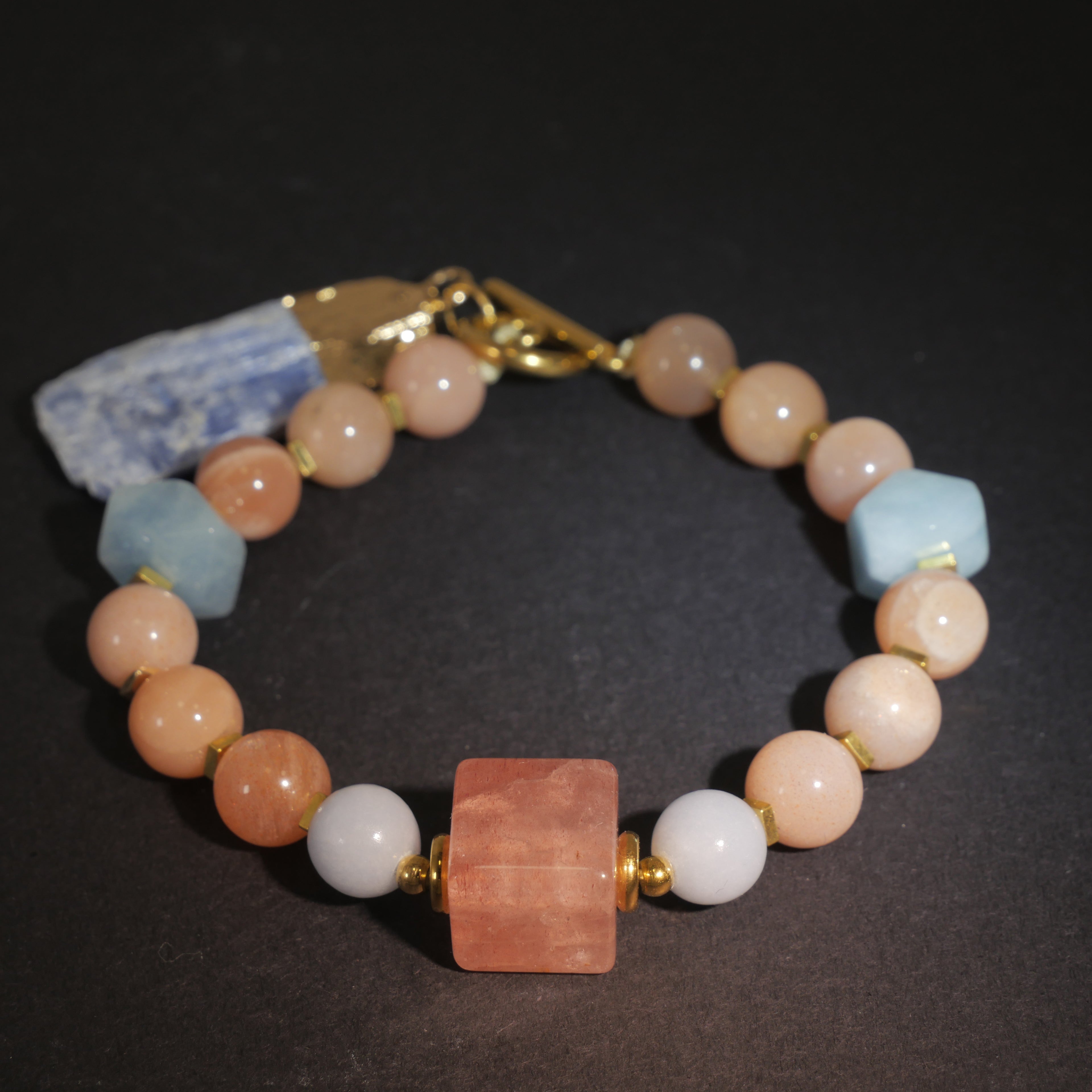 Sharded Beauty: Picasso Inspired Rhodochrosite & Aquamarine Bracelet——A fractured palette for revolution and positivity.